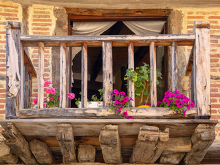 Fototapeta na wymiar Old wooden balcony in a beautiful village in the province of Soria, Spain, Calatañazor