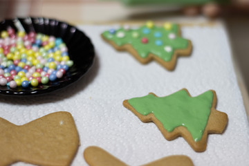 Decorating baked ginger cookies with icing 