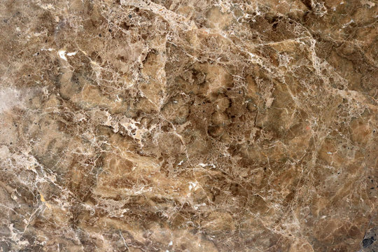 Brown marble with beautiful abstract irregular shapes and textures for a background