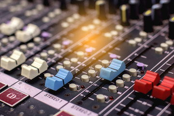 Slide the volume of the audio mixer on the console in the recording and editing work. - obrazy, fototapety, plakaty
