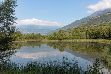 a lake in Les Iles nature reserve on the Dora Baltea river, Brissogne, Aosta Valley, Italy