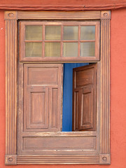 Obraz na płótnie Canvas Beautiful old window in a beautiful village of Tenerife in the Canary Islands.
