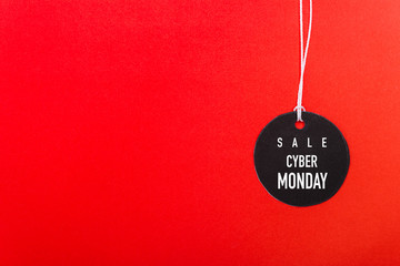 Online shopping Cyber Monday sale text on Circle Black tag label on red background, with copy space