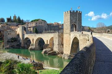 Fototapeta na wymiar Old bridge over the river Fluvia in medieval town of Besalu, province Girona, Spain.