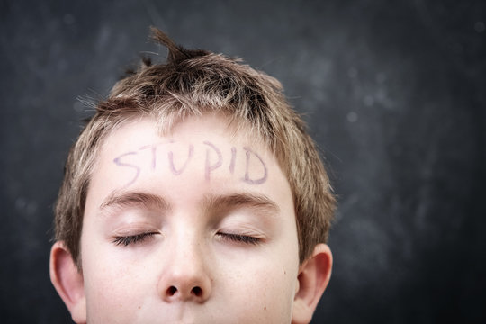 Student With Stupid Written On His Forehead