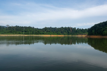 Obraz premium Beautiful image of rain-forest with reflection in water at Royal Belum State Park, Gerik Perak Malaysia.