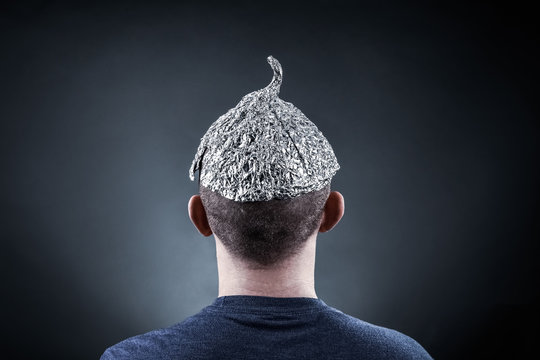 Young man wearing a tin foil hat