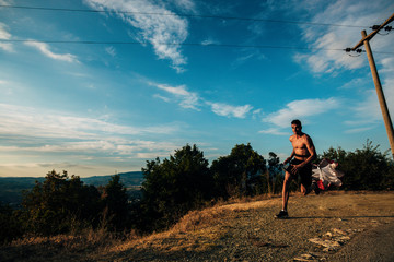 Silhouette man working out with parachute