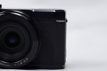 Black vintage style camera on a white isolated background