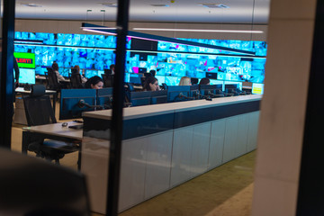 Reflection of a security agency team working at the data center