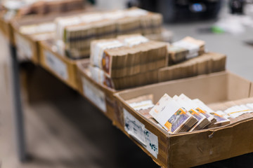 Carton boxes full of various types of banknotes