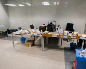 Paper money with currency bands and bags of coins