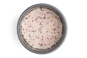 Aluminum pot for cooking rice, inside has brown rice for health already cooked on isolated white background with clipping path.