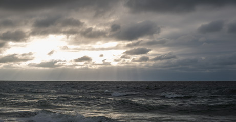 cloudy sunset with dark sea 