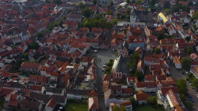 Aerial view of the city Gross-Umstadt im Odenwald in Germany. On a cloudy day in autumn. Tilt up and down from the old town.