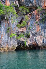 Fototapeta na wymiar Island, Ocean views near Phuket Thailand with Blues, Turquoise and Greens oceans, mountains, boats, caves, trees resort island of phuket Thailand. Including Phi Phi, Ko Rang Yai, Ko Li Pe and other is