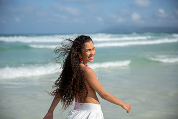 Fototapeta na wymiar Black afro young cute girl, curly hair, bikini, beach. Afro American summer vacation holiday.