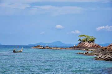 Island, Ocean views near Phuket Thailand with Blues, Turquoise and Greens oceans, mountains, boats, caves, trees resort island of phuket Thailand. Including Phi Phi, Ko Rang Yai, Ko Li Pe and other is