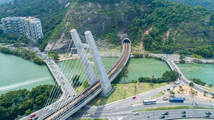 Rio de Janeiro, Rio de Janeiro / Brazil - Circa October 2019: Aerial flying over a train bridge...