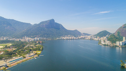 Fototapeta na wymiar Aerial view of seawater lake Rodrigo de Freitas Lagoon (Lagoa) in city of Rio de Janeiro. You can see the statue of Christ the Redeemer in the background.