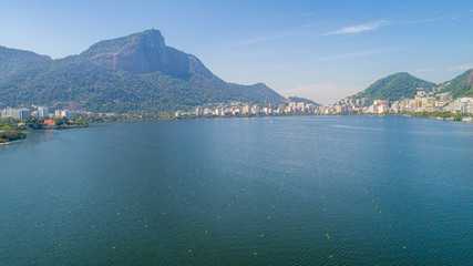 Aerial view of seawater lake Rodrigo de Freitas Lagoon (Lagoa) in city of Rio de Janeiro. You can see the statue of Christ the Redeemer in the background.