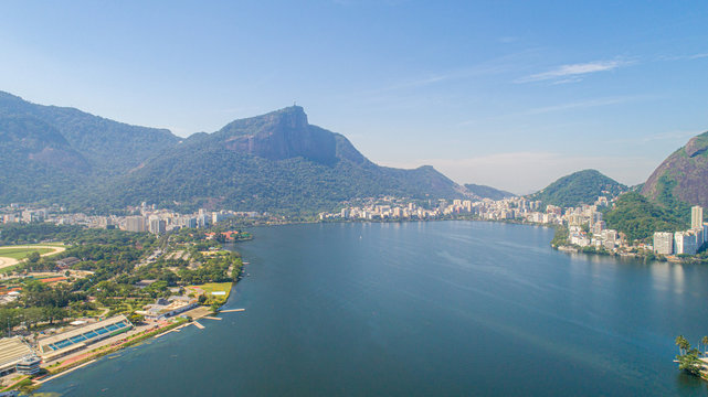Aerial view of seawater lake Rodrigo de Freitas Lagoon (Lagoa) in city of Rio de Janeiro. You can see the statue of Christ the Redeemer in the background.