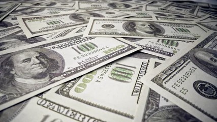 American one hundred dollar paper money pile on office desk. Concept of finance and money payment.