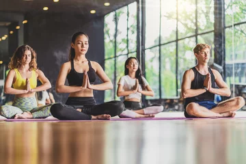 Fototapeten "Group of diversity practicing yoga class, healthy or Meditation Exercise,stretching in upward facing dog exercise, wearing sportswear bra and pants, sports and healthcare concept,." © THANANIT