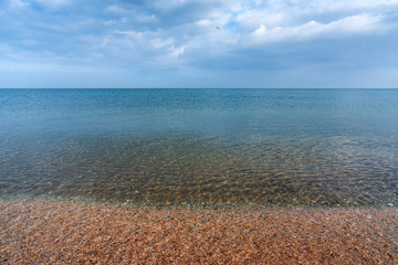 Obraz premium Calm sea shore with crystal clear water