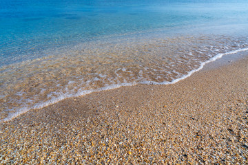 Calm sea shore with crystal clear water