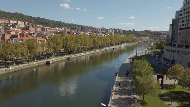 Nervion river in center of Bilbao, beautiful cityscape with many buildings