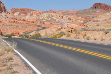 Fototapeta na wymiar Empty road in red rock canyon. Road to nowhere.