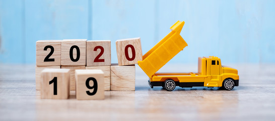 2020 Happy New year with miniature truck or construction vehicle. New Start, Vision, Resolution,...