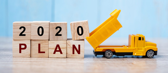 2020 Happy New year with miniature truck or construction vehicle. New Start, Vision, Resolution,...