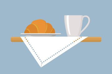 Croissant and white mug on linen napkin