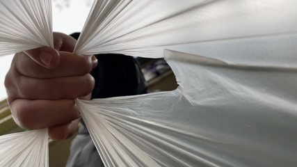 Man carrying bag with groceries view from inside of shopping bag