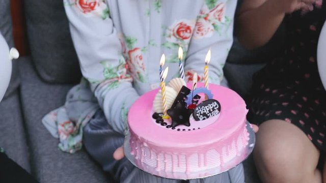Group of friends enjoying brithday party and singing together