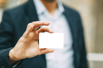  Business details for design. Blank business card in the hands of men.