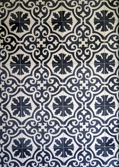 Dark blue and white ceramic tiles on wall in village in Andalusia