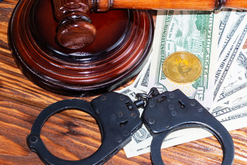 bitcoin, judge's hammer, handcuffs. Concept bitcoin ban, violation of the law.