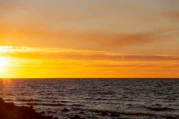 Fototapeta na wymiar Glowing ocean sunset over the ocean.