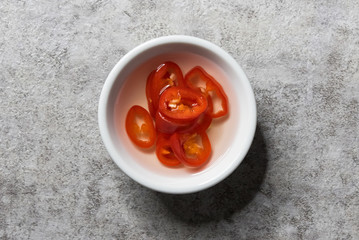 Spicy pickled sliced chili in vinegar, picy pickled sliced chili in vinegar