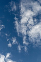 Airplane cut through cloudscape above.