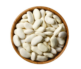 Dry white beans in wooden bowl isolated on white
