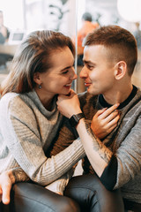Bright emotions and laughter of loving people. Couple's photo shoot at the Mall.