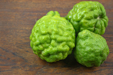 Obraz premium Bergamots on wood table for healthcares concept.