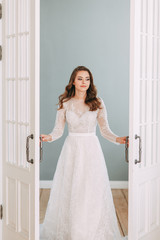 Beautiful girl in white dress, European wedding. Air and light photo shoot of the bride.