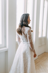 Beautiful girl in white dress, European wedding. Air and light photo shoot of the bride.