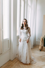 Fototapeta premium Beautiful girl in white dress, European wedding. Air and light photo shoot of the bride.