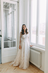 Beautiful girl in white dress, European wedding. Air and light photo shoot of the bride.